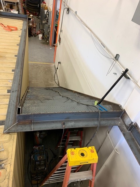 Steel mezzanine platform — diamond plate deck installation