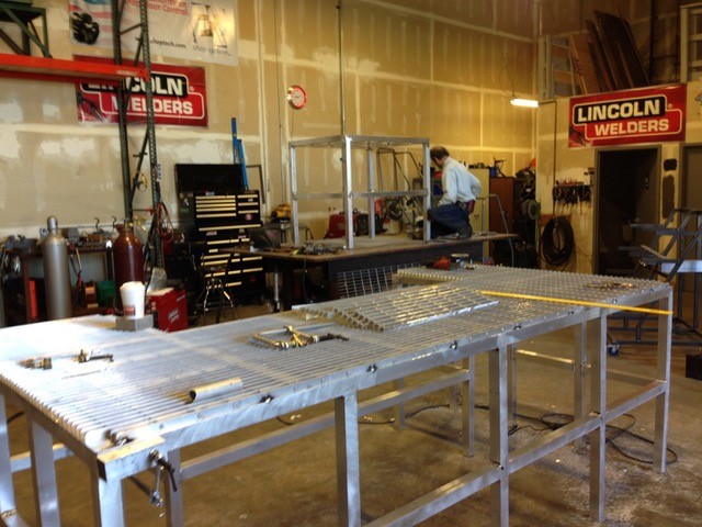 Lincoln Electric welding shop — aluminum fabrication table setup