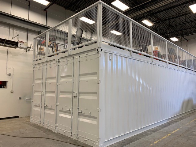 Custom shipping container modification — enclosed welding workspace