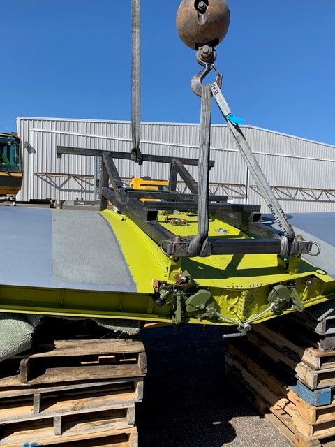 Heavy equipment rigging — crane-assisted machinery repair