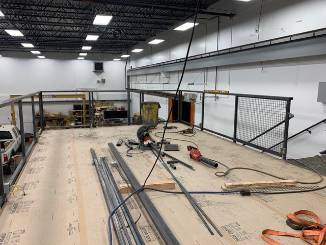 Commercial interior steel mezzanine — structural fabrication and installation
