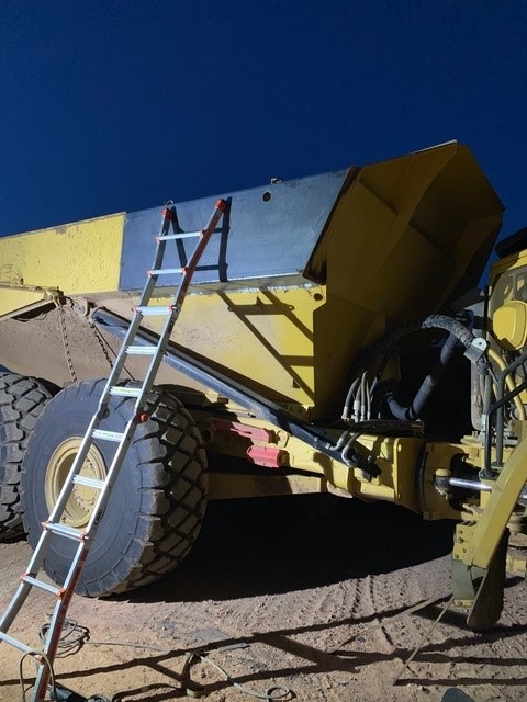 Mining haul truck bed repair — nighttime on-site welding